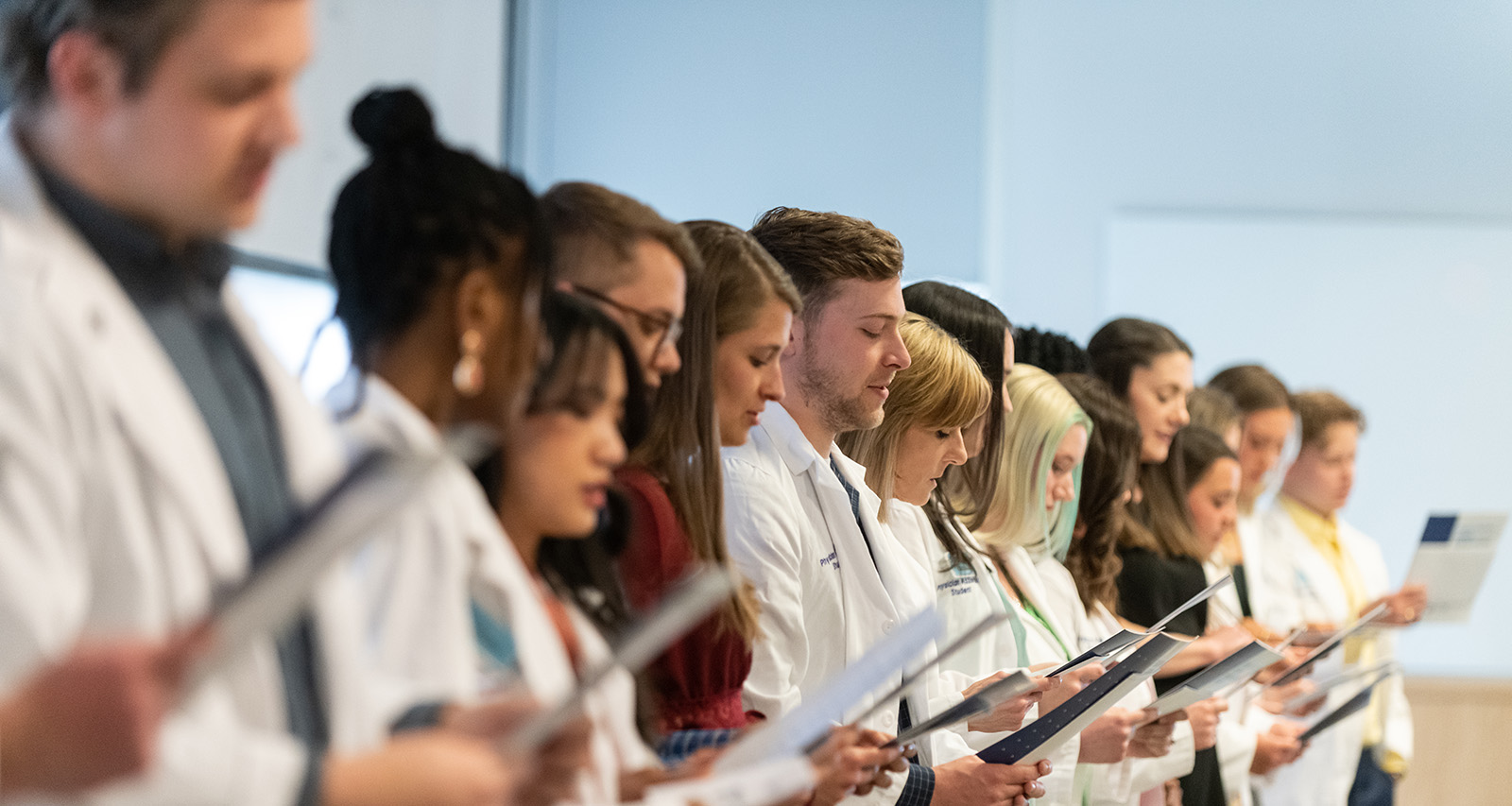 Members of the Physician Assistant Class of 2024 recite the student oath during a ceremony on April 7, 2023, in Hershey.