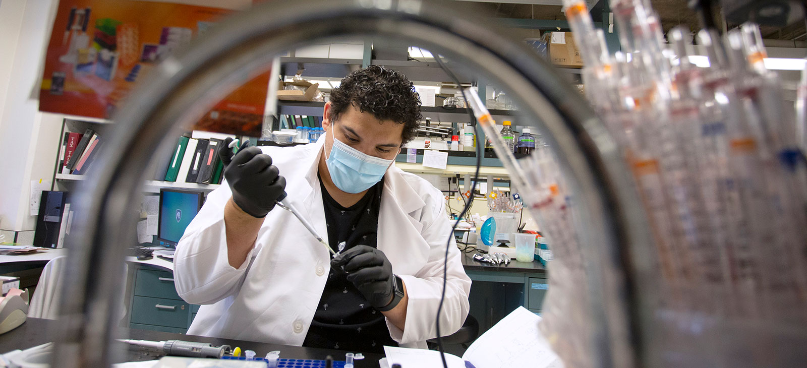 Joe Cirilo, a student in the Biomedical Sciences PhD program, is seen at work in a College of Medicine lab in June 2020.