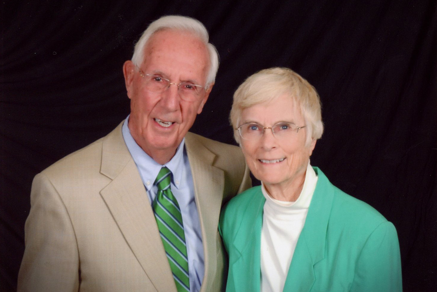 A head-and-shoulders professional portrait of Dr. George H. Conner and Betty R. Conner